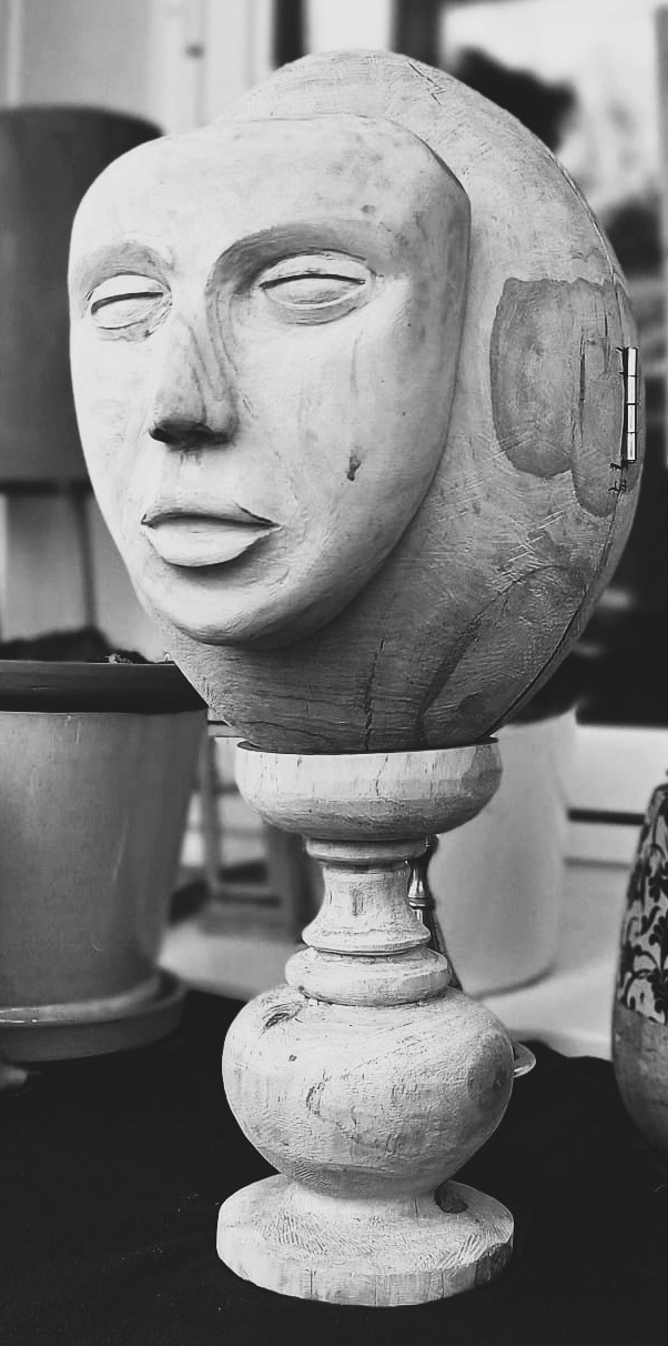 Sculpture of head sculpted into an egg-shape